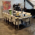 Dinning area underneath industrial type of stairs