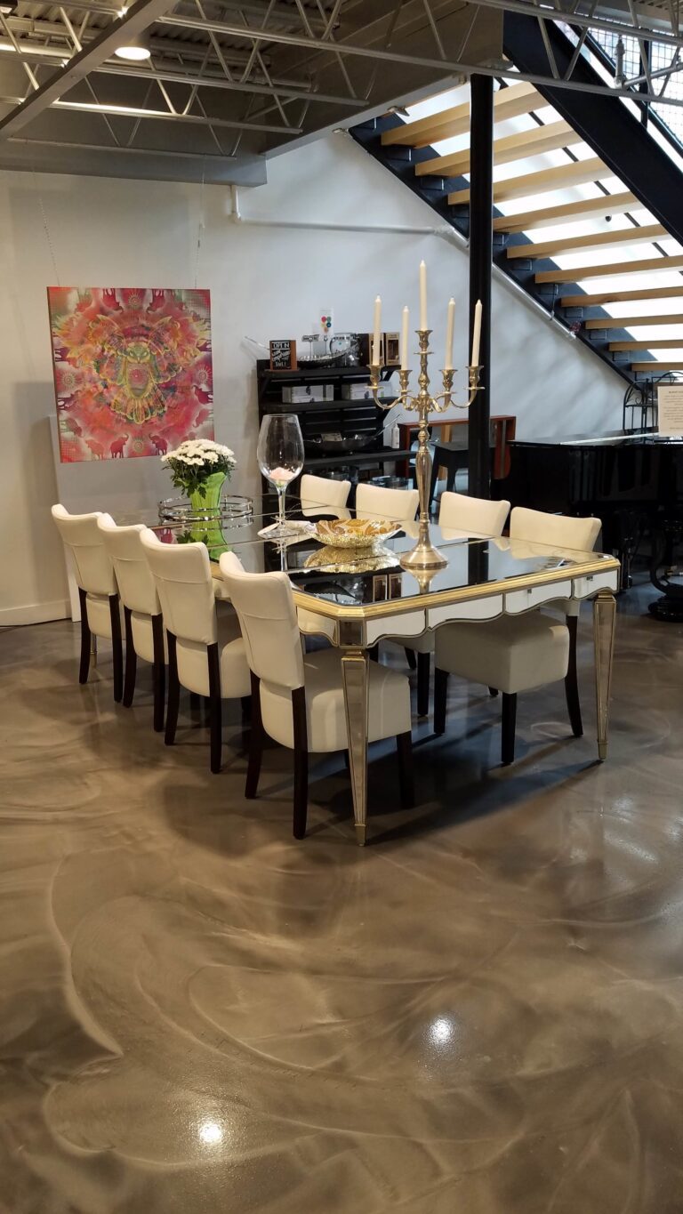 Dinning area underneath industrial type of stairs