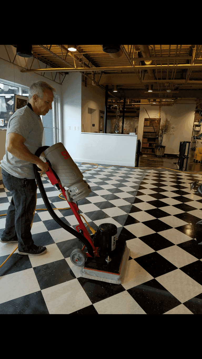 Man cleaning a tile black and white checkered floor